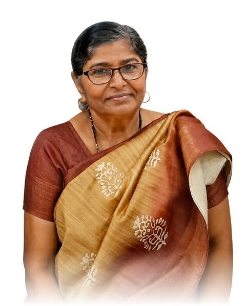 Keshkali Ishwardeen Maurya, wearing glasses and a gold and maroon sari.